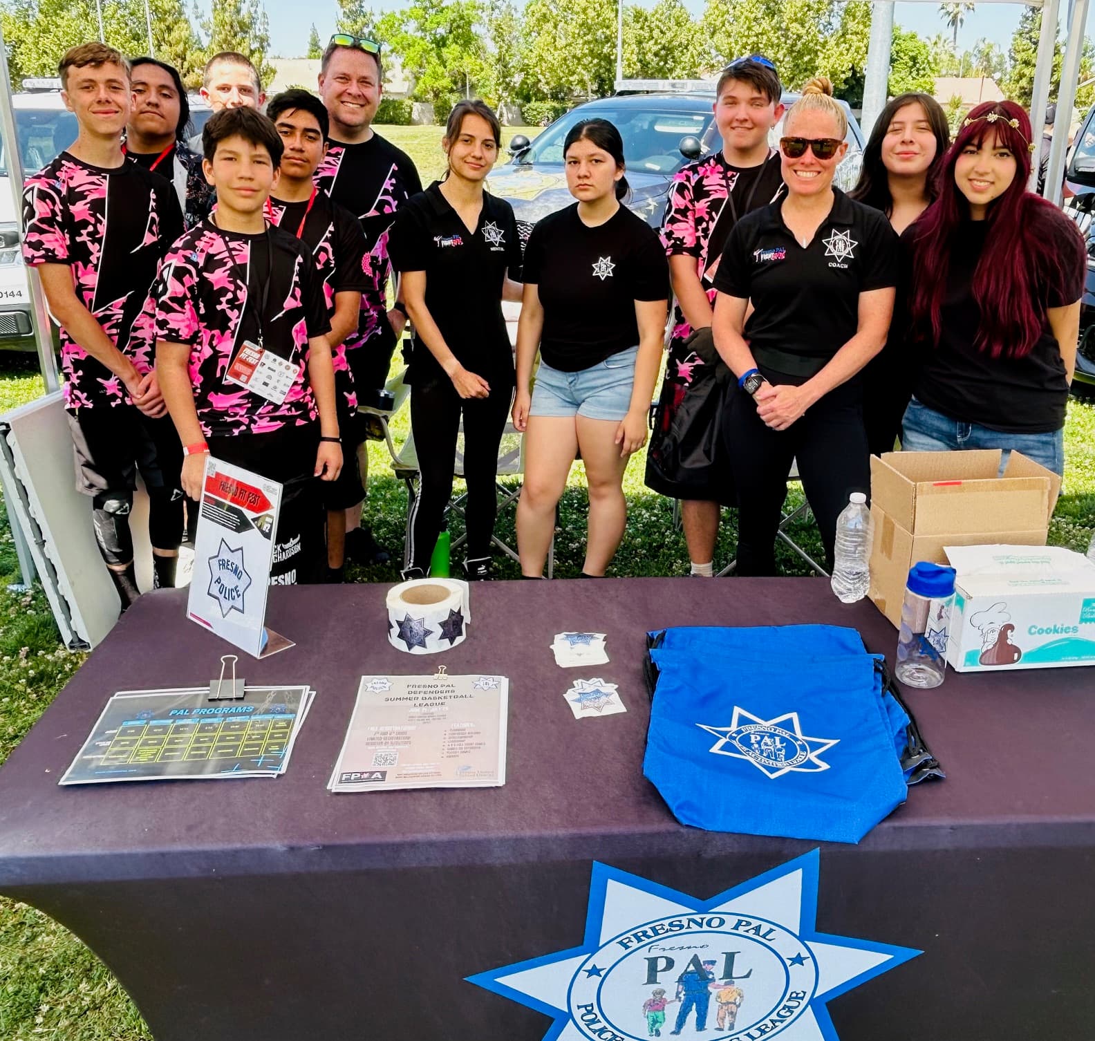 Fresno PAL Lady Boxing outreach table at FitFest